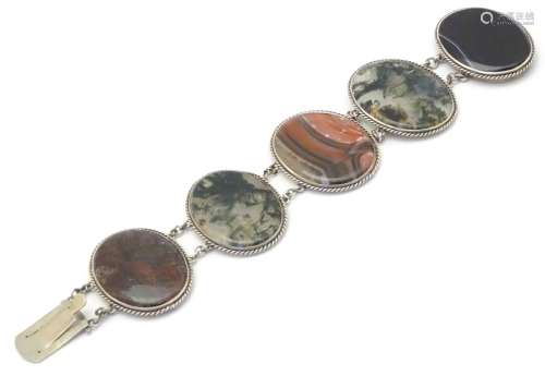 Scottish Agate jewellery: A white metal bracelet set with various agate oval specimens including