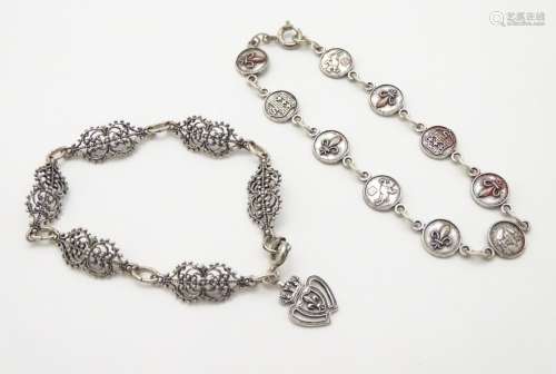 A white metal bracelet together with a silver plate souvenir bracelet for the French town of Saumur