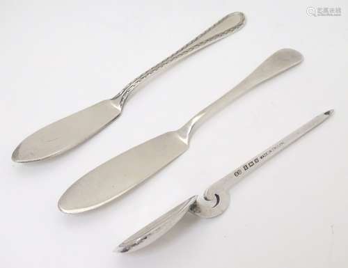 Two small silver butter knives together with a preserve spoon (3) CONDITION: Please