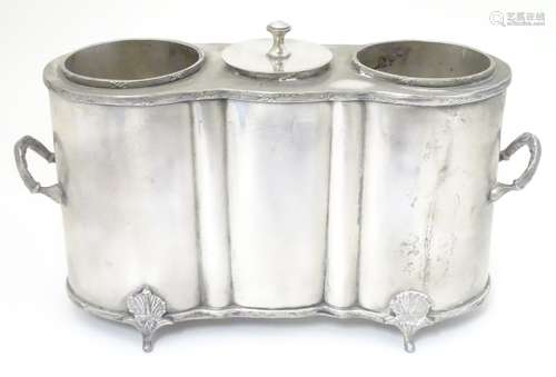 A silver plate 2-bottle wine cooler with central cooling section 15