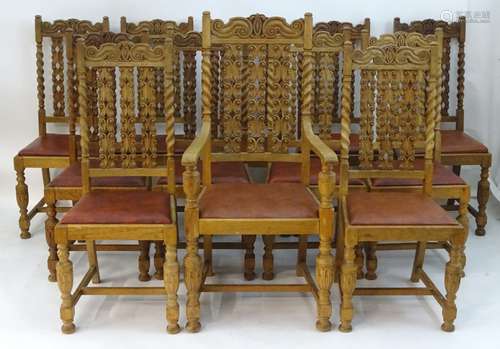 A set of twelve 19thC oak dining chairs with carved top rails, turned support and carved backrests,