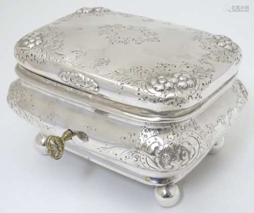 A Continental silver box with floral decoration,