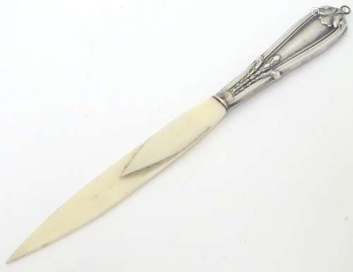 A Continental silver handled letter opener / paper/ letter clip.