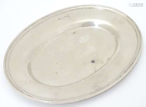 A small silver dish / plate of oval form. Hallmarked Sheffield 1910 maker William Hutton & Sons.