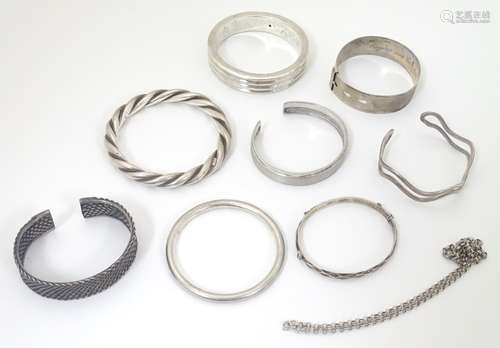 Assorted silver and white metal bangles and bracelets including a bangle hallmarked Birmingham 1980,