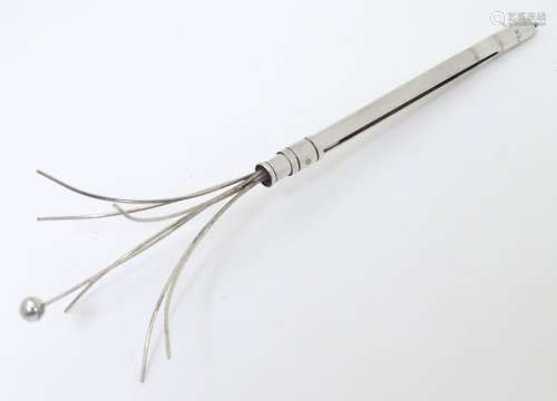 A retractable Sterling Silver swizzle stick Approx 3