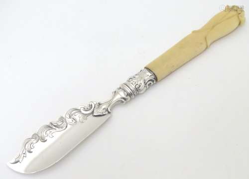 A Victorian silver butter knife with ivory handle. Hallmarked Sheffield 1875 maker AH.