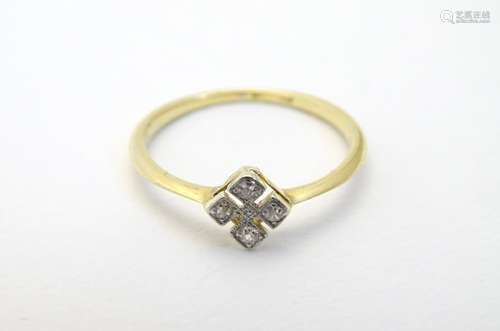 An 18ct gold ring set with four diamonds. Ring size approx. N.