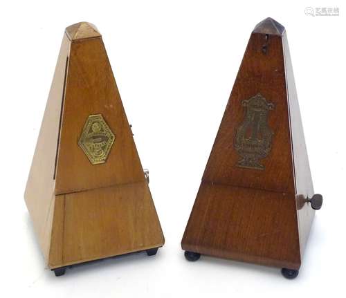 Two 20thC walnut cased clockwork metronomes by Maelzel, France.