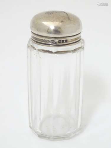 A glass bottle with silver top hallmarked London 1906 maker Percy Whitehouse 3 1/2