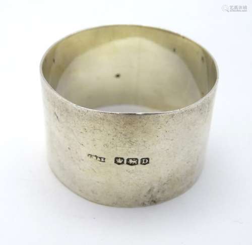 A silver napkin ring, hallmarked Sheffield 1946,