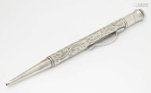 A silver propelling pencil with engraved decoration 4 3/4