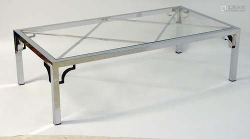 Vintage Retro mid Century modern: A large chromed and glass topped coffee table with cross bracing,