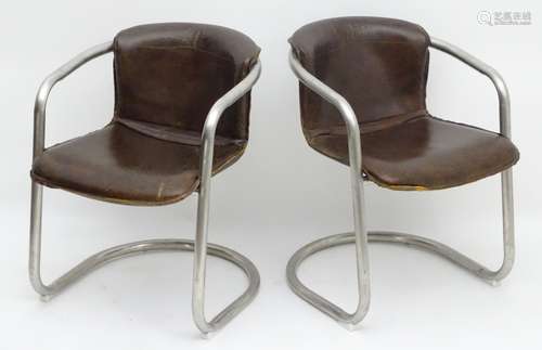 A pair of late 20thC cantilever open armchairs with chrome frames and tan leather upholstered