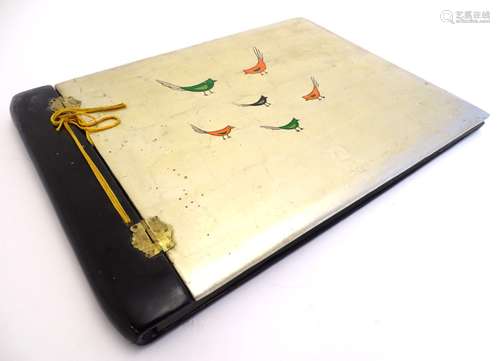 A Japanese lacquered wooden postcard / photograph album with hinged front cover decorated with