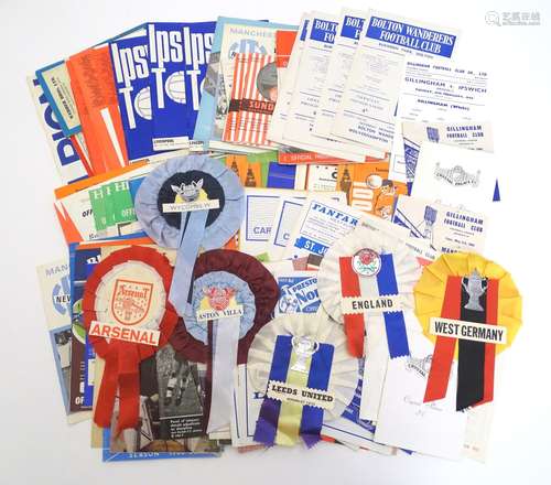 A quantity of 1960s football programmes and rosettes, football club teams to include Crystal Palace,