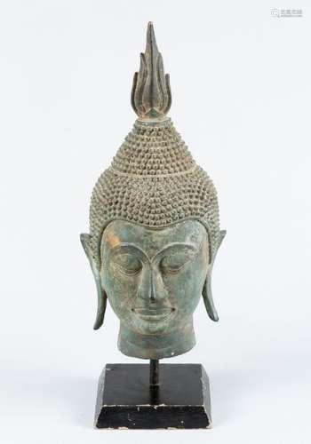 Buddhas Head, bronze cast with original patina on …
