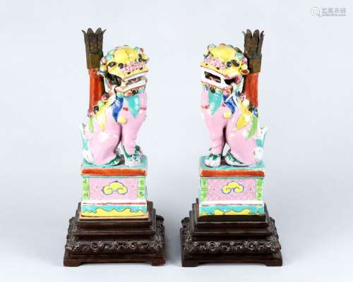 Pair of Qianlong porcelain lions, each standing on…