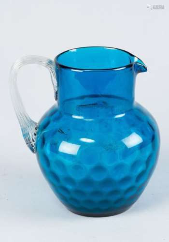 Blue glass jug, with one handgrip and spout, hand …