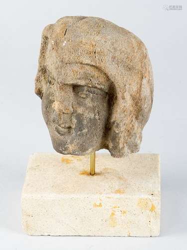 Stone head, possibly sand stone sculpted, on later…