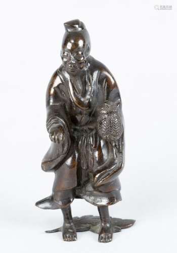 Asian bronze sculpture, of a man holding a pot; br…