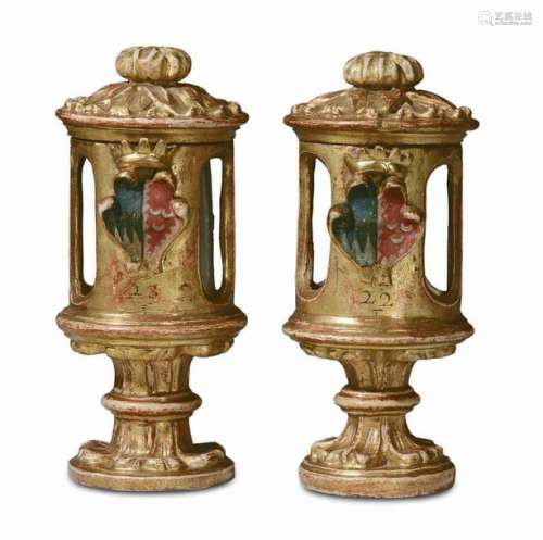 A pair of painted, gilt and carved wood containers…