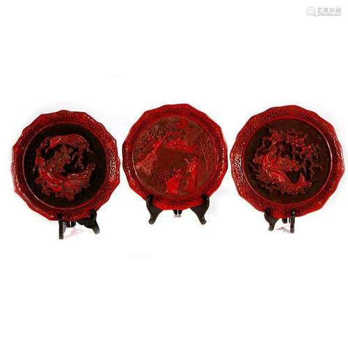 Three commemorative lacquerware plates.