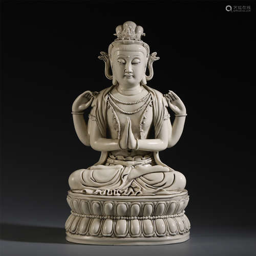 A CHINESE PORCELAIN WHITE GLAZED FOUR ARM GUANYIN