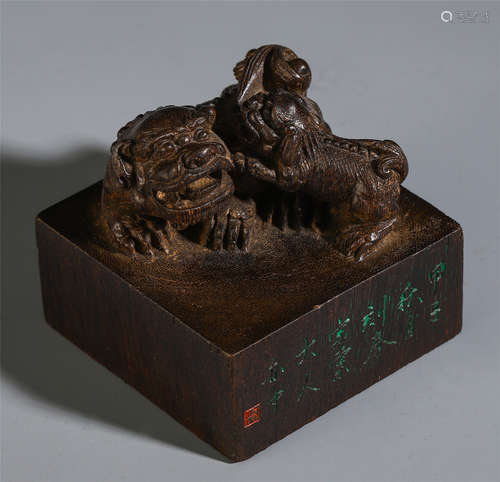 A CHINESE AGALWOOD BEAST MATHER AND SON HANDLE SEAL