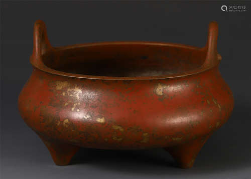 A CHINESE BRONZE TRIPLE FEET DOUBLE HANDLE CENSER