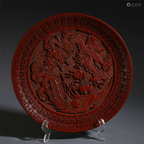 A CHINESE CINNABAR DRAGON PHOENIX PLATE