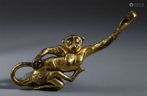 A CHINESE GILT BRONZE MONKEY WITH HOOK