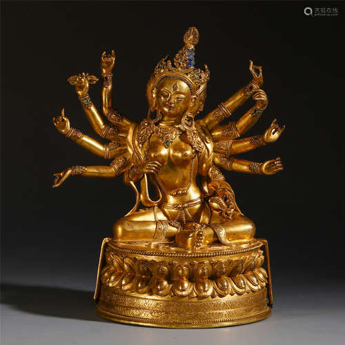 A CHINESE GILT BRONZE THREE FACE AND TEN ARM GUANYIN STATUE