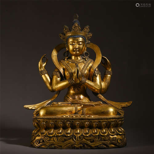 A CHINESE GILT BRONZE FOUR ARM GUANYIN STATUE