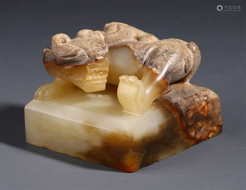 A CHINESE CINNABAR JADE BEAST SEAL