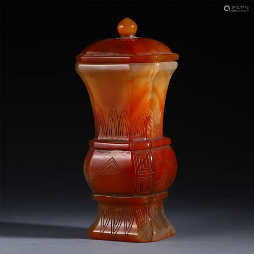 A CHINESE MOUNTED AGATE LIDDED CARVED BOTTLE