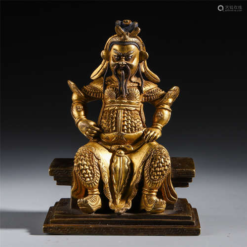 A CHINESE GILT BRONZE GAUNGONG SEATED STATUE