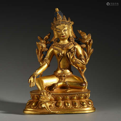 A CHINESE GILT BRONZE LOTUS HAND SEATED GUANYIN