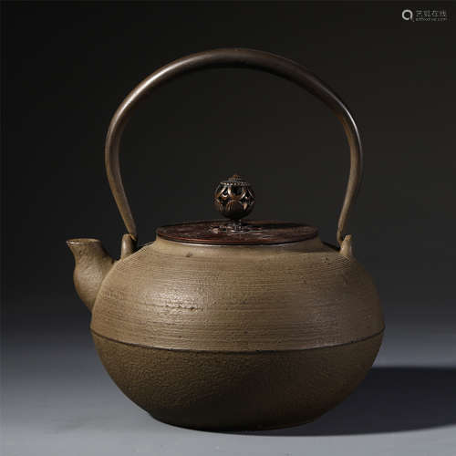 A CHINESE BRONZE LIDDED IRON KETTLE