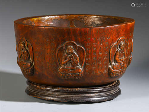 A CHINESE CARVED TARA AND SCRIPTURE WOOD ROUND BOWL