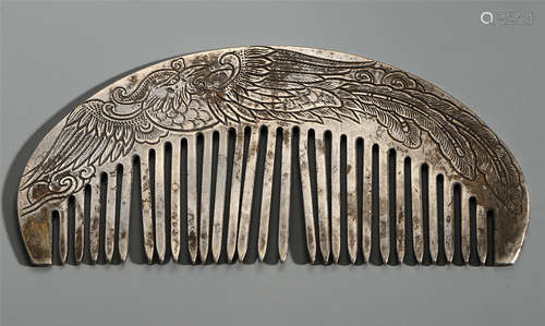 A CHINESE SILVER CARVED DRAGON PHOENIX COMB