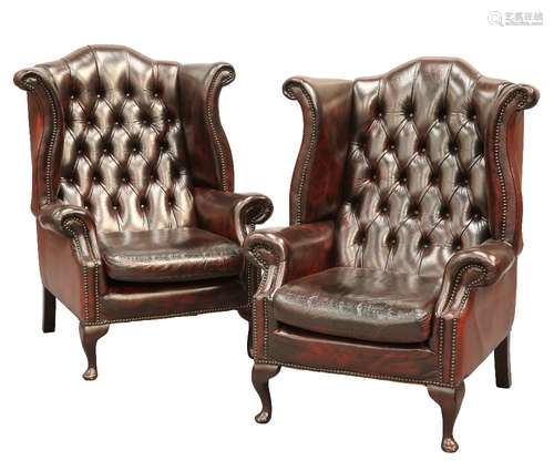 A PAIR OF BUTTON-BACK OX-BLOOD LEATHER WING CHAIRS