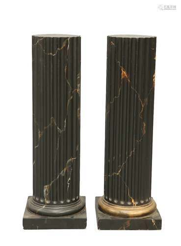 A PAIR OF FAUX MARBLE COMPOSITION COLUMNS