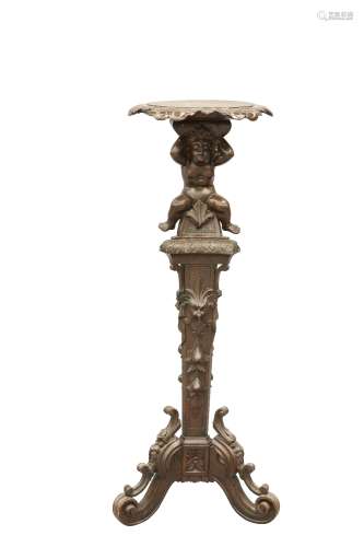 A 19TH CENTURY CARVED PINE TORCHERE