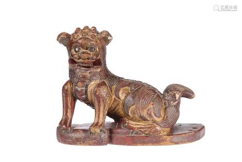 A CHINESE CARVED WOODEN MODEL OF A FOO DOG