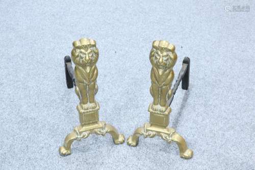 A PAIR OF 19TH CENTURY BRASS LION ANDIRONS. 43.5cm high