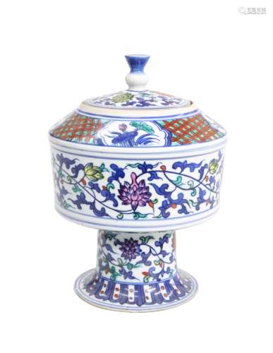 A CHINESE DOUCAI PORCELAIN STEM JAR AND COVER