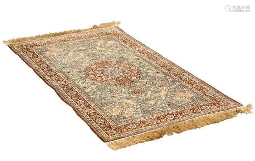 AN INDIAN SILK RUG, with shaped circular roundel to the centre