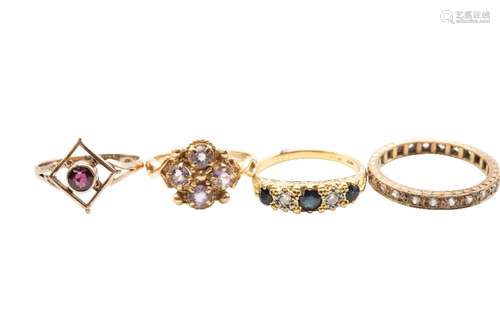 A collection of four yellow gold and gem set rings