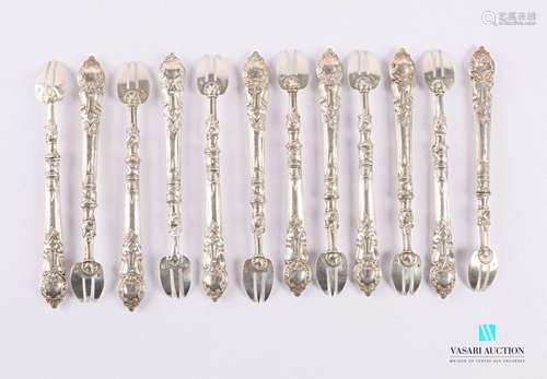 A suite of twelve forks with oyster shells in fill…